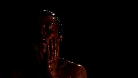 Bloody face and darkness Stock Footage 99073314