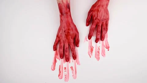 Bloody female hands slide over white background. Stock Footage
