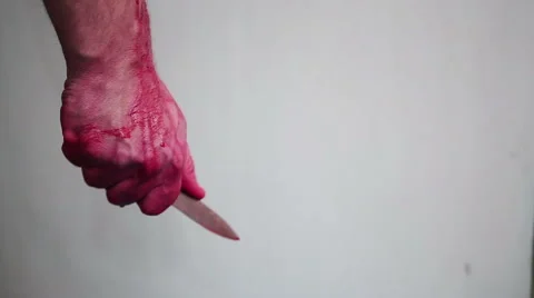 Bloody hand with a knife Stock Footage 47135839