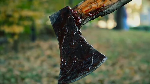 Bloody murder weapon, crazy serial maniac cutting victim's body with sharp axe Stock Footage 59083224