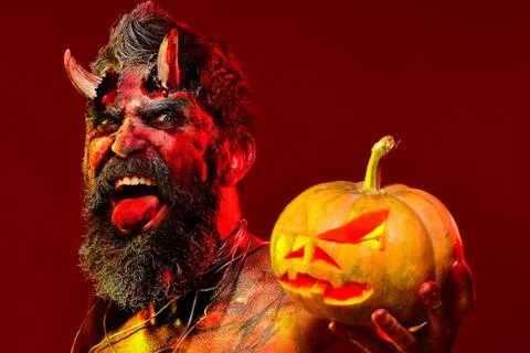 Bloody skin for Halloween. Halloween holiday celebration - Man demon with Stock Photos