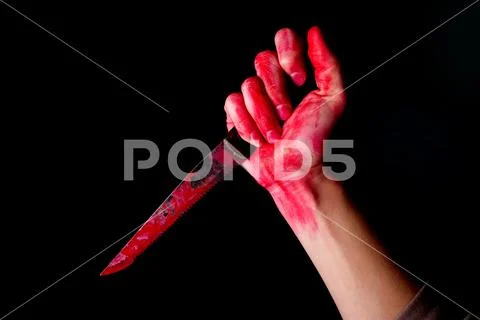 Bloody stabbing. Hand with knife Stock Photos