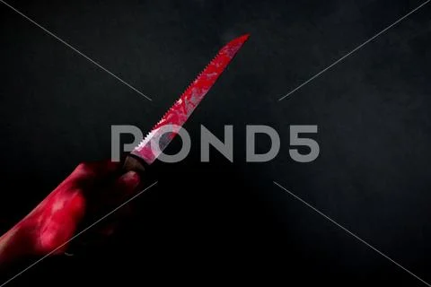 Bloody stabbing. Hand with knife Stock Photos