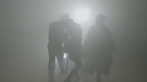 Bloody terrible scary zombie invasion walking out from a foggy forest and hea Stock Footage