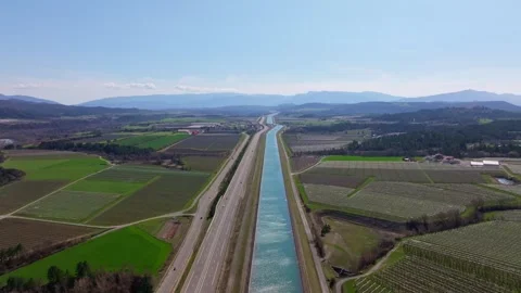 Blooming grove sits between river bend and country highway Stock Footage 307314975