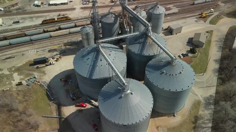 Bloomington, USA (IL) - 2026, Mar 20: Grain bins, conveyors, top down aerial Stock Footage 342155765