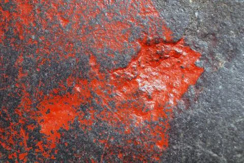 A blot of paint on a stone in the shape of a fish Stock Photos