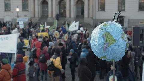 A blow-up globe being held at a climate protest. 스톡 동영상 120599237