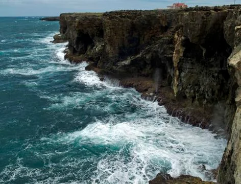 Blow hole spouting vertically at ragged point bay Stock Photos