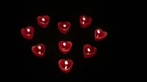Blow  Red Candles In Shape Of Heart On Black Background Stock Footage 155551069