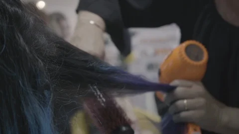 Blowdrying colored hair Stock Footage 87745960