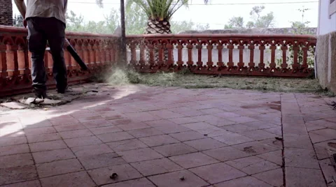 Blower Cleaning Patio Floor Stock Footage 50220874