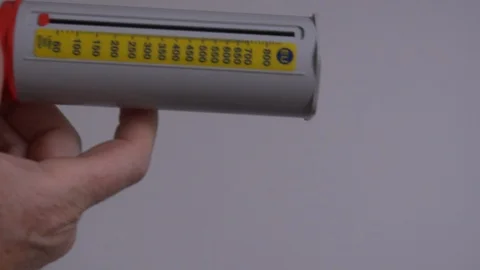 Blowing into an asthma puffer close up 4K Stock Footage 112171419