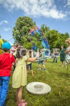 Blowing big bubbles Stock Photos