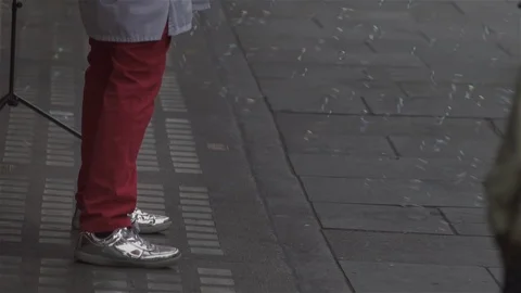 Blowing Bubbles and close up on silver shows in busy city street. Stock Footage 93205998