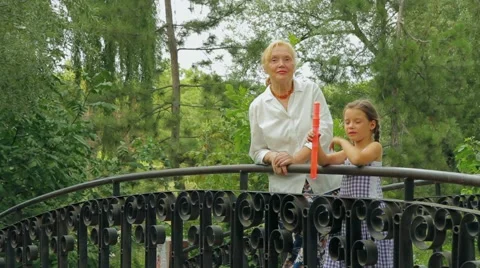 Blowing Bubbles On A Bridge Stock Footage 52689842