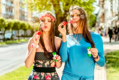 Blowing bubbles in the city. Stock Photos