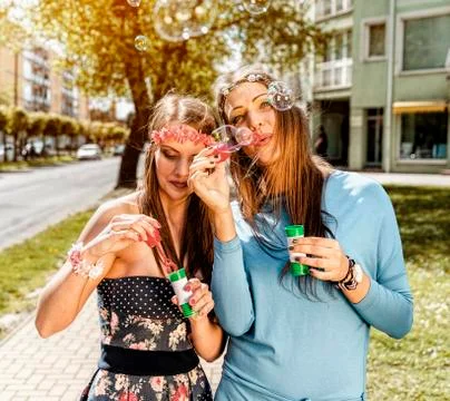 Blowing bubbles in the city. Stock Photos