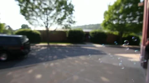 Blowing bubbles in front of camera Video stock 11134573