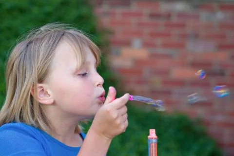 Blowing bubbles Stock Photos