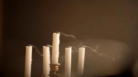 Blowing candlestick with candles Stock Footage 77076393