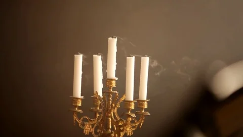 Blowing candlestick with candles Stock Footage 77076418