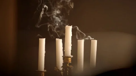 Blowing candlestick with candles Stock Footage 77076422