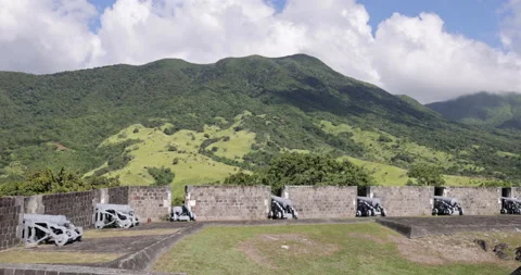 Blowing clouds cast shadow over canon lined ramparts of Brimstone Hill Fortress Stock Footage 233854766