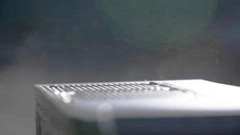 Blowing dust with air compressor inside a personal computer Stockbeeldmateriaal 104971573