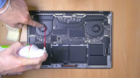 Blowing dusty fan inside a notebook with canned air. Stock Footage 238908640