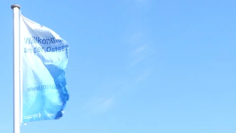 Blowing flag with german writing : 'welcome to the baltic sea' - Rostock Stock Footage 138613682