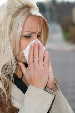 Blowing Her Nose Stock Photos