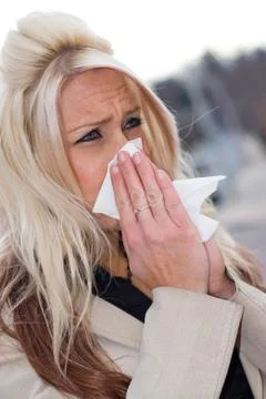 Blowing Her Nose Stock Photos