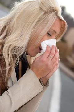 Blowing Her Nose Stock Photos