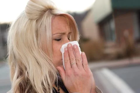 Blowing Her Nose Stock Photos