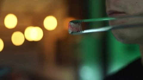 Blowing of hookah coals in slow motion Stock Footage 81919934