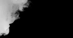 White horizontal steam, smoke isolated on black background. a