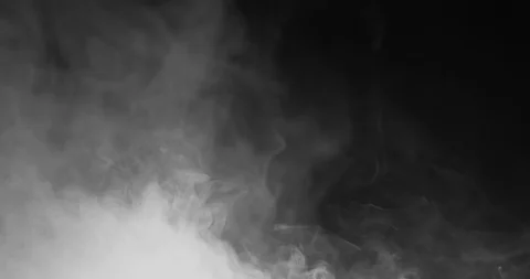 Blowing horizontal steam with white smoke isolated on black background Stock Footage
