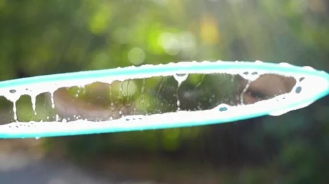 Blowing large soap bubbles in the first person in the park Vidéo 68367669