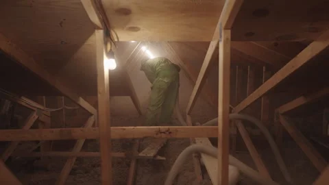 Blowing in Loose Cellulose Insulation in to Home Attic Weatherization Stock Footage 340923465