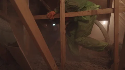 Blowing in Loose Cellulose Insulation in to Home Attic Weatherization Stock Footage 340923636