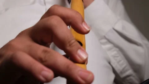 Blowing nay instrument Stock Footage 208868402
