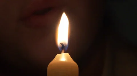Blowing out a candle Stock Footage
