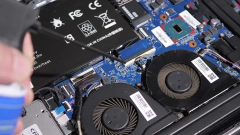 Blowing Out Computer Components - Macro Stock Footage 220737228