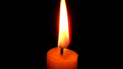 Blowing out the flame of a candle Stock Footage
