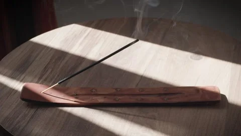 Blowing Out Incense with Hand Stock Footage 302465598