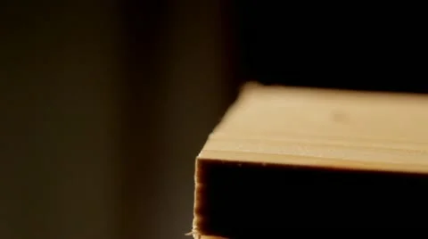 Blowing sawdust off wood Stock Footage