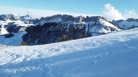 Blowing snow over snowy surface on top of mountain in Switzerland - snowstorm Stock Footage 152586391