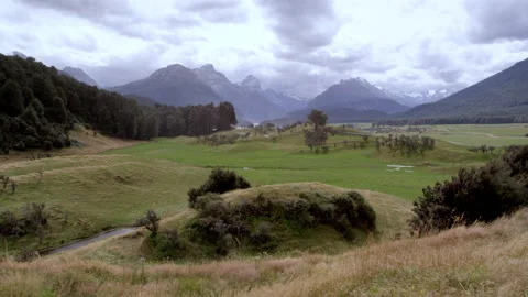 Blowing tussocks with mountains behind  Stock Footage 159801207