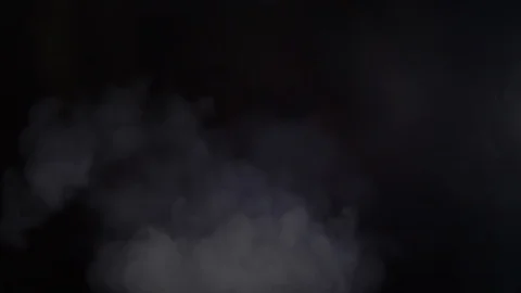 Blowing white smoke on a black background Stock Footage 104555480